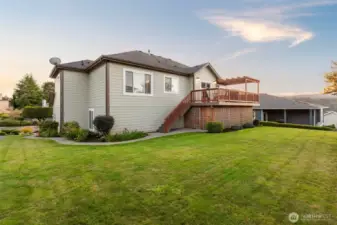 Back view of the home. Lovely walk path around to the front