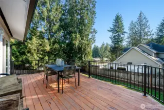 Relax and entertain on the new back deck with access to the fenced yard and garage