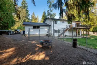 Outside, enjoy a huge fenced backyard with space for garden beds, tons of parking including RV parking, plus a two-car garage