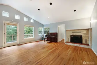Wood-burning fireplace. The fourth bedroom/bonus room is through the far door.