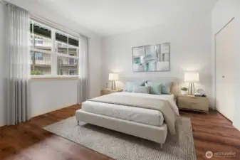 Large bedroom with virtual staging showing potential layout.