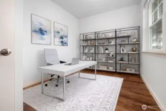 Spacious den or office area, ideal for working from home, hobbies, or a peaceful reading area.