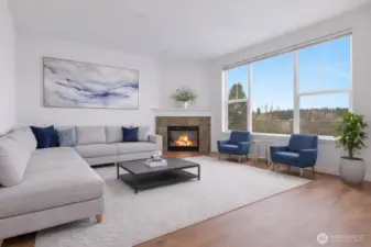Showcasing the virtually staged living room with gas fireplace.
