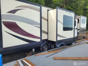 Sellers RV when parked at deck. Six slides out and then stairs get placed at door.
