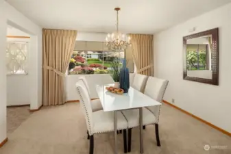 The formal dining room is located off the entry and overlooks the manicured front yard.