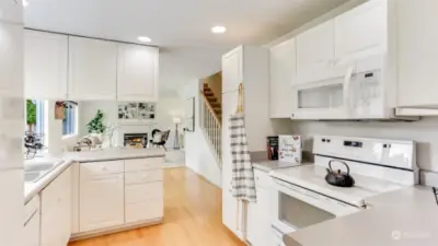 Kitchen is the perfect size with pantry, tons of cabinet space and all appliances stay!