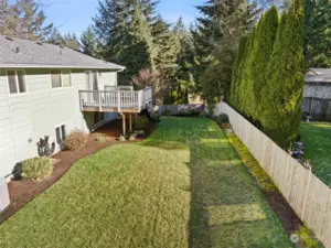 Oversized yard with terraced levels on the side of the house - plenty of room for your favorite outdoor activities.