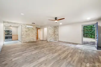 Inside the newly built ADU, with stacked-stone wall accents and an open layout.