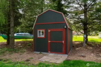 This is one of three sheds, which all have electricity. This could be used as a playhouse or art room, or whatever your imagination comes up with!