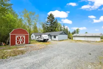 including several outbuildings, including an 864 sq ft powered shop