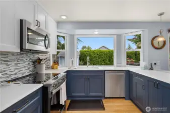 Look out to the lovely back yard from your large kitchen windows.