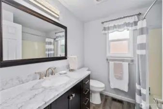 The full bath on the upper level is also updated.