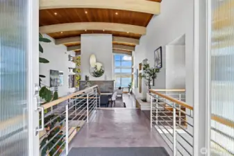 Architecturally significant 6,488 home with elegant atrium entry built around huge standing granite stone monolith, custom barrel ceilings.