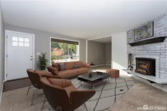 Inviting and full of natural light, the wood burning fireplace insert offers great warmth during the winter.