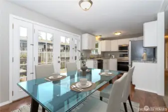 Adjacent from both the family room & the living room, the kitchen features newer stainless steel appliances