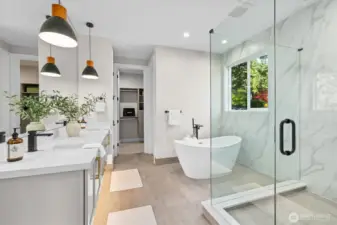 Primary bath suite features floating vanity, heated floors and luxurious dual-valve multi-fixture shower experience