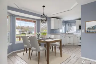 Virtually staged to highlight the dining area.
