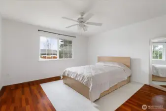 Primary bedroom situated separately from the other two bedrooms for added privacy.