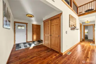 Functional foyer with ample storage, integrated laundry, and direct garage access