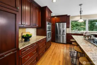 Custom cabinetry and pantry space keep everything organized.