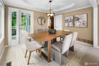 Large deck for outdoor dining and entertaining accessed off the formal dining room.