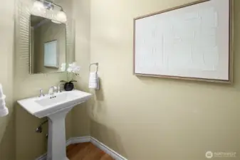 Main-floor powder room with modern fixtures and guest-friendly convenience.