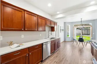 The layout opens seamlessly to the breakfast nook and family room for easy connection.