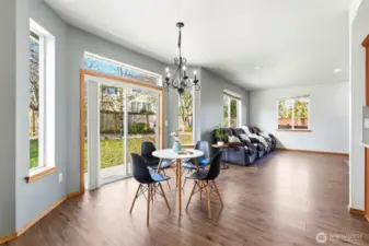 The sunny breakfast nook is the perfect spot for morning coffee or casual meals.