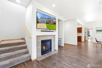 A cozy gas fireplace anchors the space, perfect for relaxing evenings.