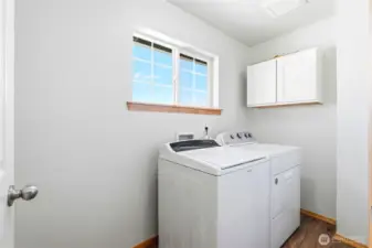 Convenient utility room also upstairs.