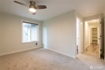 Another view of the primary bedroom.  There is no shared wall with this bedroom and loads of natural light flood this room.  There is a bathroom inside this bedroom.  The shelved closet down the hall allows for linen storage.   There is a nother bathroom just down this same hallway across from the other 2 bedrooms.