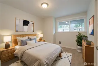 VIRTUALLY-STAGED!  Bedroom 1 of 3.  There is a large closet just behind the door.  Ample room for a queen sized bed plus dresser and nightstands in this room.
