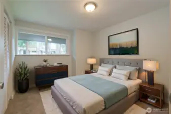 VIRTUALLY-STAGED!  Bedroom 2 of 3.  There is a large closet just behind the door.  Ample room for a queen sized bed plus dresser and nightstands in this room.