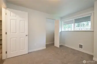 Same bedroom empty.  Bedroom 2 of 3.  There is a large closet just behind the door.  Ample room for a queen sized bed plus dresser and nightstands in this room.