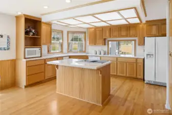Multiple windows fill the kitchen with light