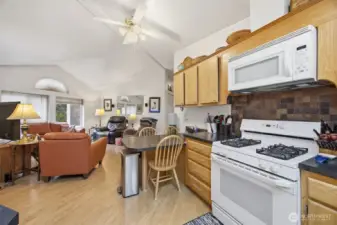 The kitchen is open to the family room and there is a 3 seat eating bar, gas range, dishwasher, and refrigerator that all stay with the sale of this home.