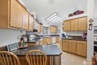 The kitchen is very spacious and has an abundance of counter and cabinet space.