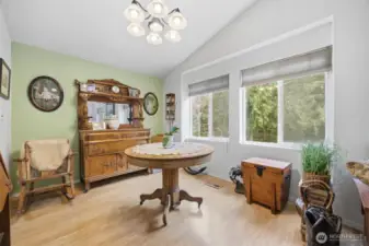 The dining area is also spacious and looks out to the towering evergreen trees.