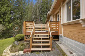The front porch overlooks the front lawn and fire pit and a great sitting porch.