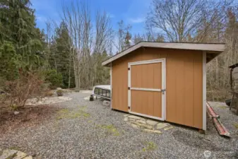 Another view of the storage shed by the rear deck of the home.