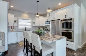 Chef's kitchen with 3 full size ovens