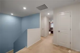 Upstairs landing, bonus living space lies straight ahead - laundry space is directly to the left.