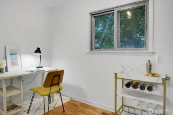 a view of the good sized flex space that can be used for a private office, walk-in pantry off of the kitchen, or both!