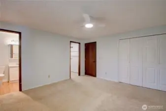 Primary bedroom looking toward the 3/4 en-suite bathroom and walk in closet