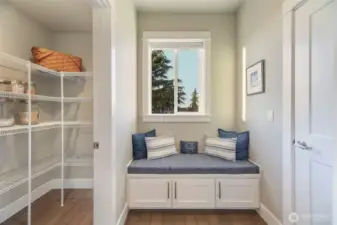 Large pantry and mudroom off back of kitchen with ease of grocery unloading right at garage door.