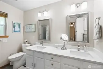 Primary Bath updated with heated floors double sink and comfort height toilet.  Tub and Shower