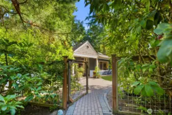Inviting entry to this mid-century modern home on a corner lot in Wilburton