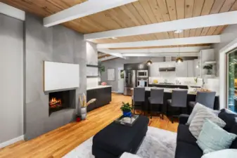 Family room off the kitchen wired for tv/entertaining with a gas fireplace