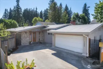 Home faces north and has a full double car garage with wash room.  Requires some plumbing repairs.