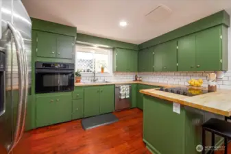 Freshly painted cabnets, new butcher block counters, hardware, and back splash create welcomes you home.
